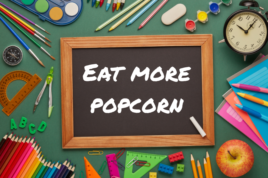 Chalkboard that says Eat More Popcorn